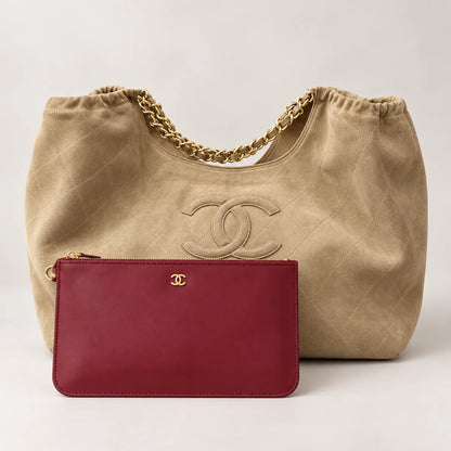 Beige quilted shoulder bag with complimentary red zip pouch