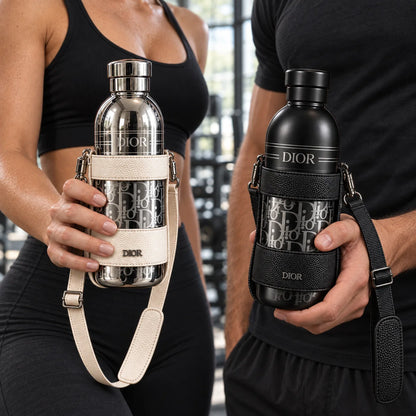 Close-up of a woman holding the silver Dior Aqua bottle and a man holding the black bottle at the gym