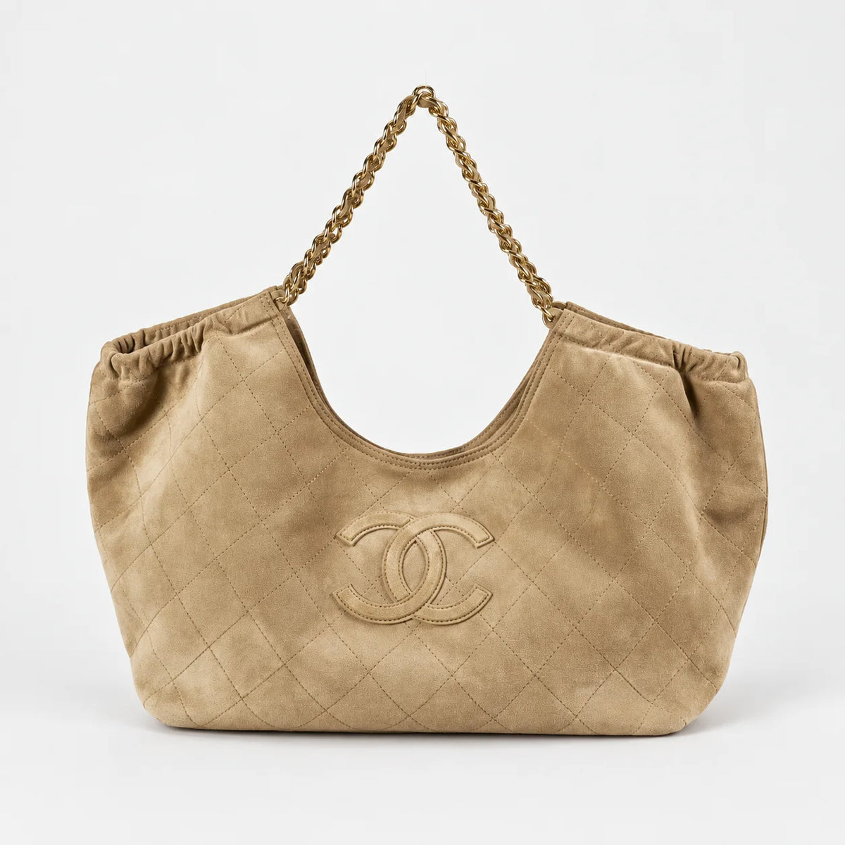 Beige quilted hobo shoulder bag front view on light gray background
