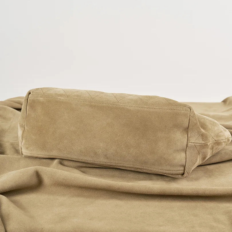 Base view of beige quilted hobo shoulder bag