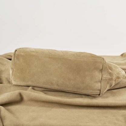 Base view of beige quilted hobo shoulder bag