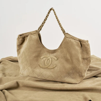 Beige quilted hobo shoulder bag front view from supplier